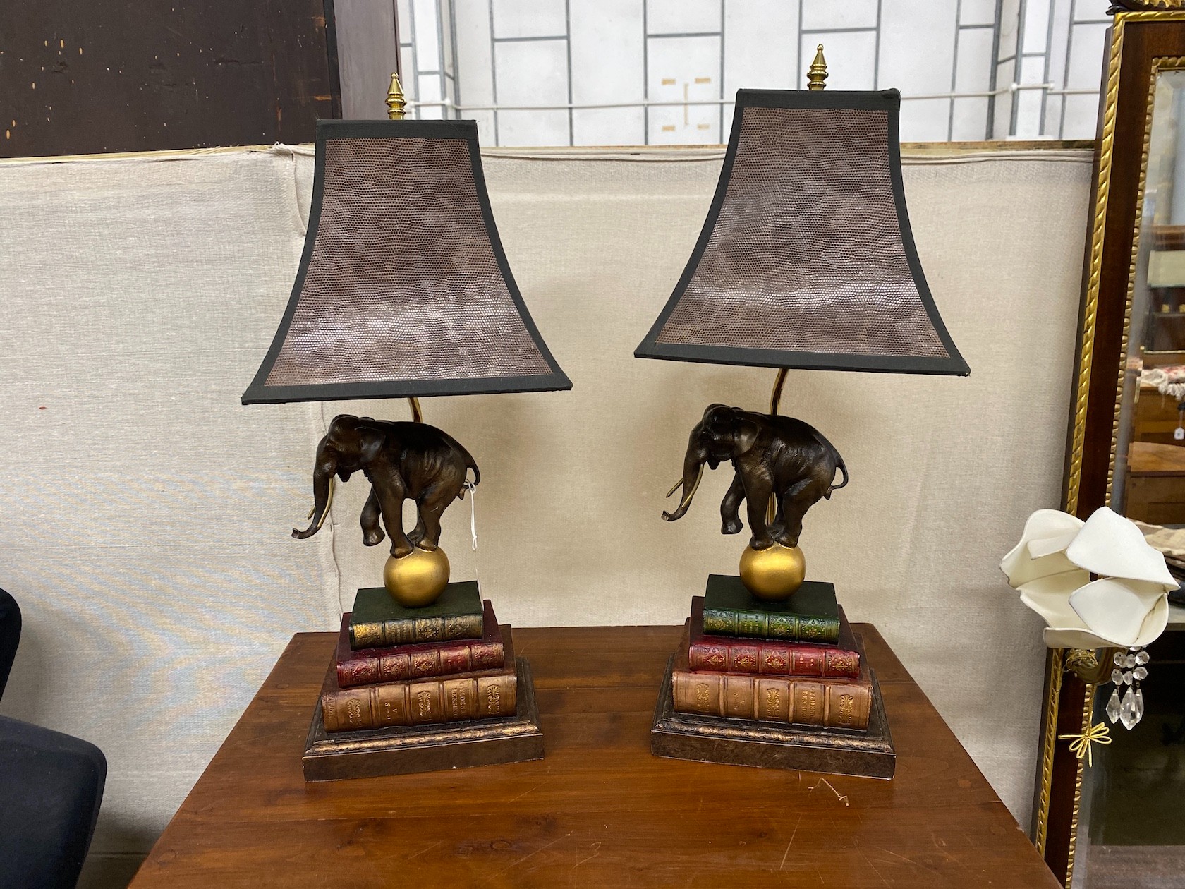 A pair of Thomas Blakemore elephant and book stack tablelamps and shades, height including shades 62cm